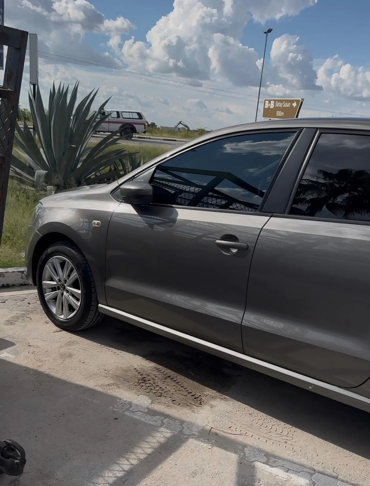 Grey Volkswagen Polo rental vehicle side profile